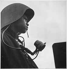 "Richard Salter, CK 3-c, a talker of a gun station, aboard the U.S.S. Tulagi (CVE-72) off the coast of southern France." - NARA - 520858.jpg