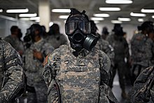 Empire Shield soldiers pictured in chemical protective masks in 2014 106th Rescue Wing Airmen participate in Joint Task Force Empire Shield 141223-Z-SV144-089.jpg