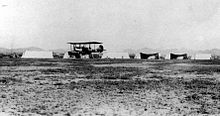 A 1st Aero Squadron Curtiss R-2 takes off at Columbus, New Mexico. Note the hangar tents to the rear. 1st Aero Squadron Curtiss R-2 Columbus NM.jpg