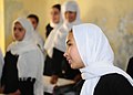 A classroom of Afghan girls say goodbye to their visitors from the Afghan National Civil Order Police and the Coalition Forces. (4677626669).jpg