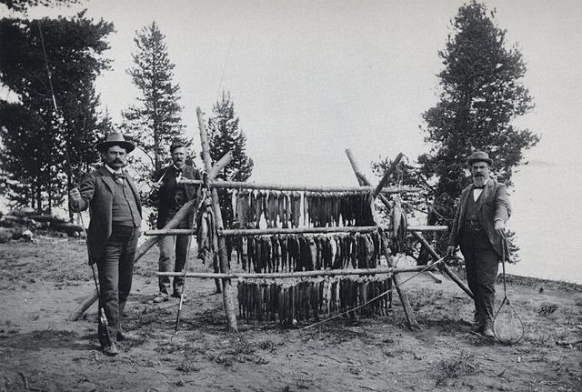 An 1897 photo of anglers at West Thumb Geyser Basin on the western shore of Yellowstone Lake