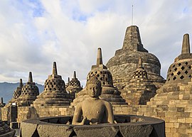 Buddha statue in Borobudur (Indonesia), the world's largest Buddhist temple. Borobudur-Temple-Park Indonesia Stupas-of-Borobudur-04.jpg