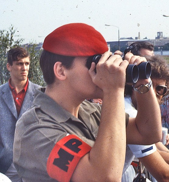 File:British military police officer looks across Berlin Wall with field glasses, 1984 (cropped).jpg