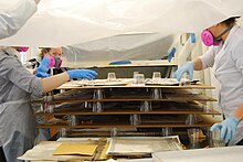 Conservation staff drying mold-damaged materials CCAHAStaff drying.jpg