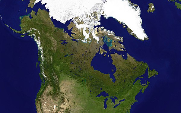 Forest axis. Note the light-colored prairie in the southwest and the greyish Barren Grounds to the northeast.