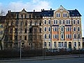 Apartment building in semi-open development with a front garden