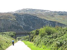 Cyclist on the road leading to the Breakwater Country Park - geograph.org.uk - 1415832.jpg