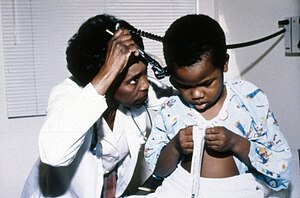 Doctor examining child, Seattle, circa 1970s (20851540008).jpg