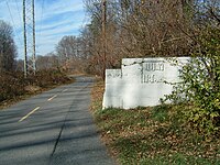 One abutment of the bridge that carried the Fairfax line over the W&OD Railway at Franklin Fairfax Abutment.JPG