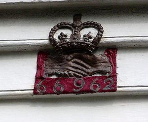Fire mark of the Hand in Hand Fire & Life Insurance Society on a house in Dulwich Fire mark Dulwich.jpg
