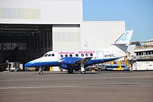 FlyPelican Jetstream 32, with special colours promoting fundraising for the McGrath Foundation FlyPelican, wearing Pinkup Mudgee titles, (VH-NTL) British Aerospace Jetstream 32 at Bankstown Airport.jpg