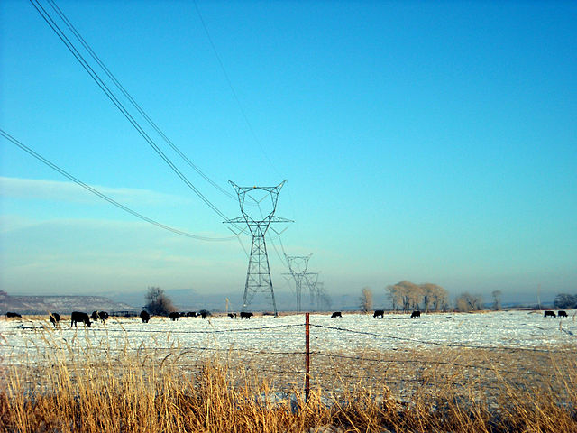Three-phase high voltage transmission lines use alternating currents to distribute power over long distances between electric generation plants and co
