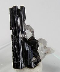 Image 6Hübnerite, the manganese-rich end-member of the wolframite series, with minor quartz in the background (from Mineral)