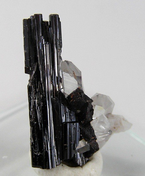 Hübnerite, the manganese-rich end-member of the wolframite series, with minor quartz in the background