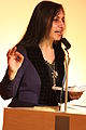 English: Imtiaz Dharker (1954—), Scottish/Pakistani Muslim poet, speaking at the British Library in 2011. Français : Poète musulman d'origine pakistanaise et écossaise, lors d'une conférence à la British Library en 2011. Italiano: Poeta musulmano d'origini scozzese e pachistana, durante una conferenza alla British Library nel 2011.