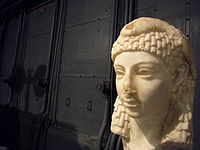 Possible sculpted head of Cleopatra VII wearing an Egyptian-style vulture headdress, discovered in Rome, either Roman or Hellenistic Egyptian art, Parian marble, 1st century BC, from the Capitoline Museums[428][429]