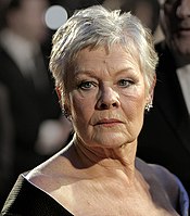 Judi Dench has played M seven times, the only woman in a role previously played by two men in the Eon films. Judi Dench at the BAFTAs 2007.jpg