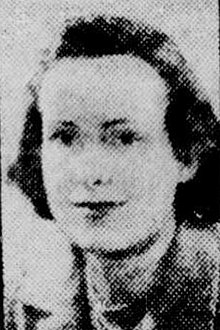 Black and white portrait of a young woman with short hair wearing a suit