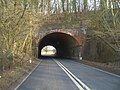 The road tunnel taking the A272 road through a 64-foot (19.5 metre) high embankment.