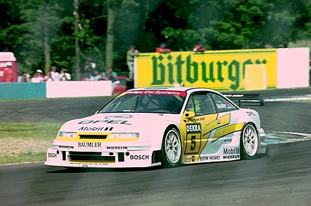 Manuel Reuter - Opel Team Joest - Opel Calibra V6 exits The Esses, Donington Park 1994 DTM