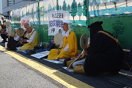 Buddhist monks of Nipponzan-Myōhōji protest against nuclear power near the Diet of Japan in Tokyo on 5 April 2011.