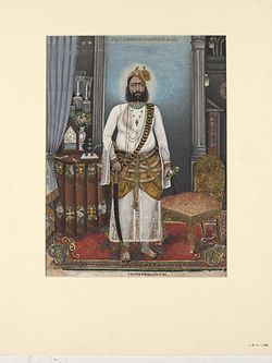 Portrait of Thakur Raja Bakhtawar Singh, standing in a European-style interior..jpg