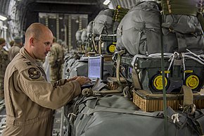 An officer programs a JPADS bundle with drop coordinates in preparation for a resupply mission Preparing the cargo area 130110-F-PM120-391.jpg