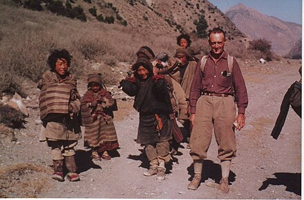 Rene de Milleville with Tibetan refugees in Gandaki Valley, near Jomosom, Nepal, October 1966. Note the head straps for carrying heavy loads. Most Tibetan refugees pass through Nepal to India, where The 14th Dalai Lama resides.