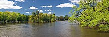 A picture of the Rivière des Mille Îles in Terrebonne, in which the Île Saint Jean  the Île aux moutons  and the Île-des-moulins can be seen from left to right, respectively.