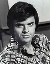 Robert Urich (pictured in 1973), leading actor of Spencer: For Hire, portrays himself in "Woody for Hire Meets Norm of the Apes". Robert urich 1973.JPG