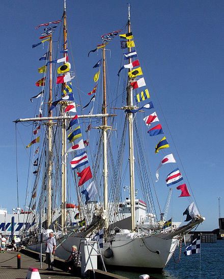 Two sailing ships dressed overall with their signal flags