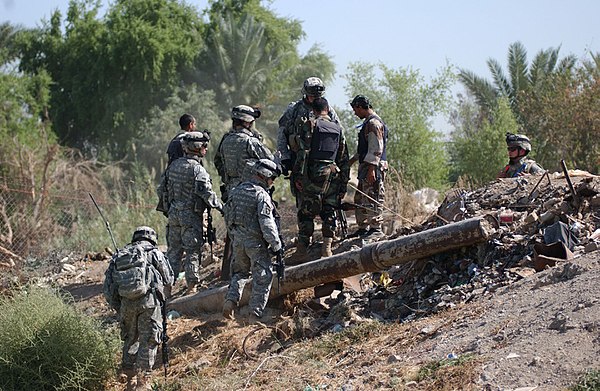 Iraqi National Police and U.S. Army Soldiers from the 2nd Battalion, 506th Infantry Regiment, discover a weapons cache in Dora, Baghdad on 8 Oct. 2006