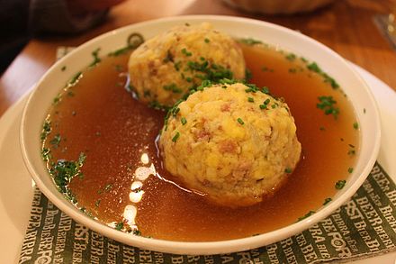 Traditional Speckknödel soup. The cuisine of South Tyrol combines culinary influences from Italy and the Mediterranean with a strong alpine regional and Austrian influence.