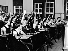 A group of students studying home science theory at State High School. State High School students.jpg