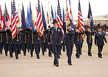 USAF Military Training Instructor wearing a campaign hat State and Federal flags carried by Air Force personnel.jpg