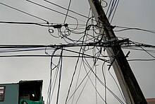 An example of a utility pole in Puerto Rico Tangled power lines in Puerto Rico.jpg