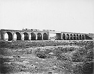 Train on a stone bridge