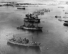 A gaggle of Gilliam-class vessels at Pearl Harbor, awaiting disposal in Operation Crossroads - from front to rear, Crittenden (APA-77), Catron (APA-71), Bracken (APA-64), Burleson (APA-67), Gilliam (APA-57), Fallon (APA-81), one unidentified ship, and Fillmore (APA-83) Crossroads Gathering Pearl.jpg