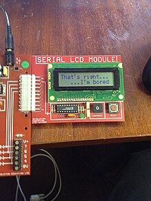 A Higher Technological Studies pupil interfaces a serial LCD module with a STAMP micro-controller. Technological Studies.JPG