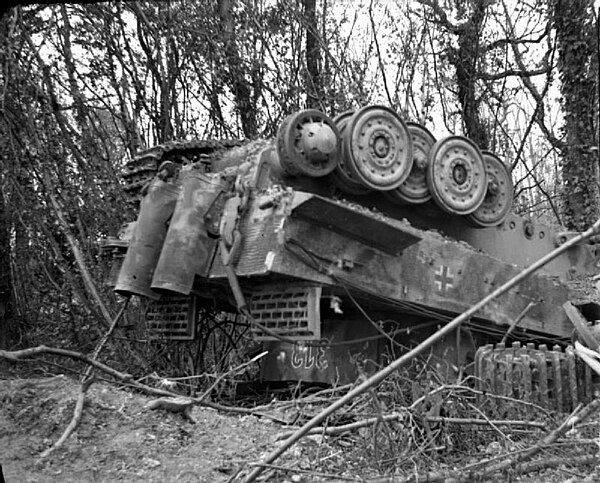 A Tiger I of the 503rd battalion overturned at Manneville by the bombing during Operation Goodwood.