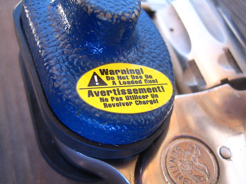 File:Trigger lock on a revolver - close up of warning.jpg