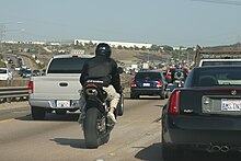 Two motorcycle riders lane splitting in California Two riders lane splitting.jpg