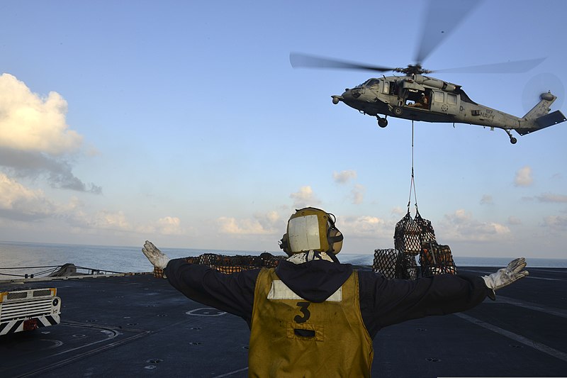 File:U.S. Navy Aviation Boatswain's Mate (Handling) Athony Morrison directs an MH-60S Seahawk helicopter assigned to Helicopter Sea Combat Squadron (HSC) 7 on the flight deck of the aircraft carrier USS Harry S 140307-N-CC806-028.jpg