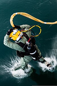 U.S. Navy Diver enters the water during a training evolution at the Naval Diving and Salvage Training Center