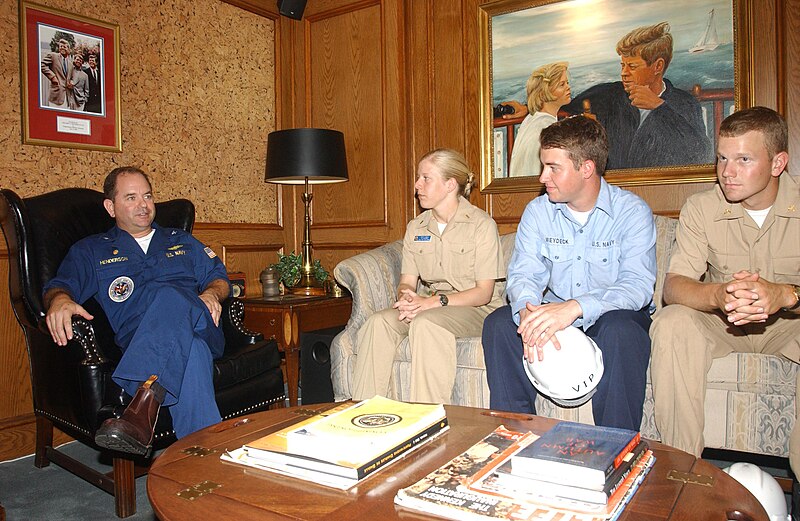 File:US Navy 030618-N-6651N-001 Capt. Ronald H. Henderson, Commanding Officer of USS John F. Kennedy (CV 67), welcomes a group of midshipmen from Commander Carrier Group Six in the Commanding Officer's in-port cabin.jpg