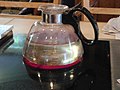 Step 1: Water is heated to a boil in the glass carafe.