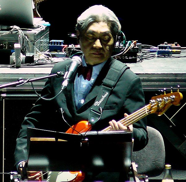 Hosono performing with YMO in 2008.