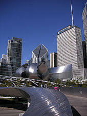 Gehry designed both the bridge and Jay Pritzker Pavilion with curving stainless steel plates. BP Bridge facing NW.jpg