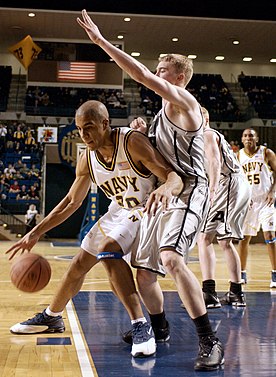 Top left: Navy player attempts to dribble past Army defender; Top right: Demetri McCamey dribbles on the fast break; Bottom left: Collin Sexton dribbles between his legs; Bottom right: Trevon Duval dribbles behind his back.