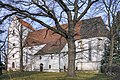 Bartholomäus Church with furnishings and a cemetery with baptismal font, grave cross and Luther stone